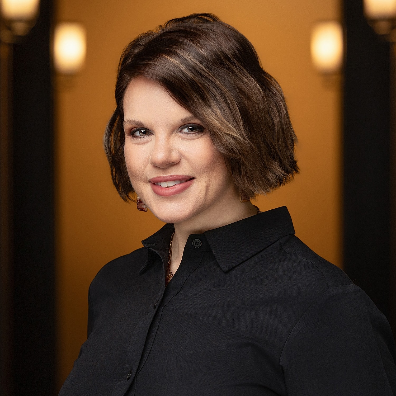 Portrait of a woman with short, stylish hair.