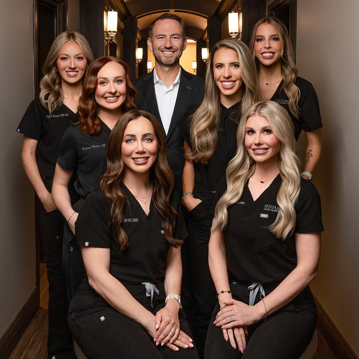 Medical team posing in a hallway.