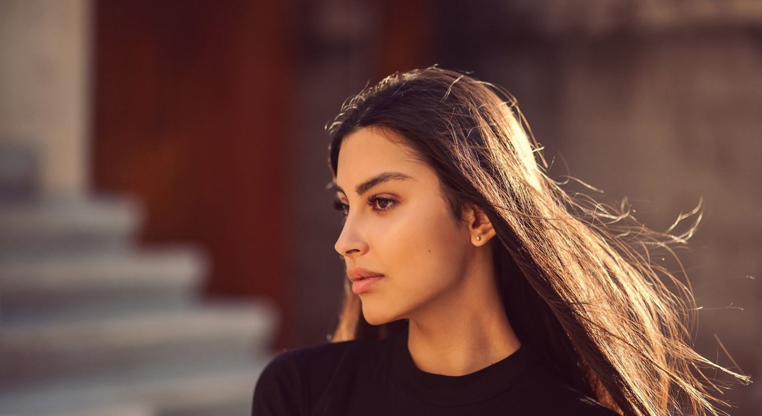 Woman with long hair in natural light.